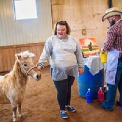 a group of people standing next to a dog