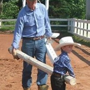a man that is standing in the dirt