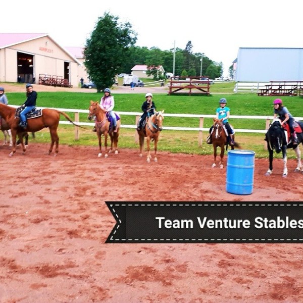 a group of people riding on the back of a horse