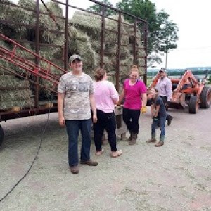 a group of people standing next to a truck