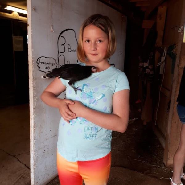 a young girl holding a cell phone