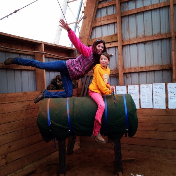 a woman standing in front of a building