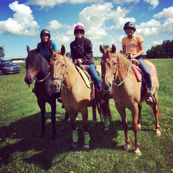 a group of people riding on the back of a horse