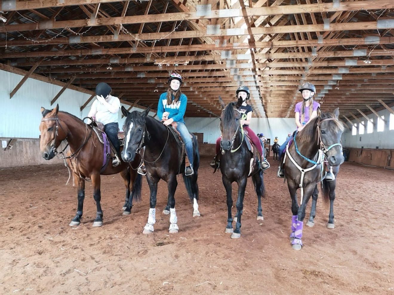 a group of people riding on the back of a horse