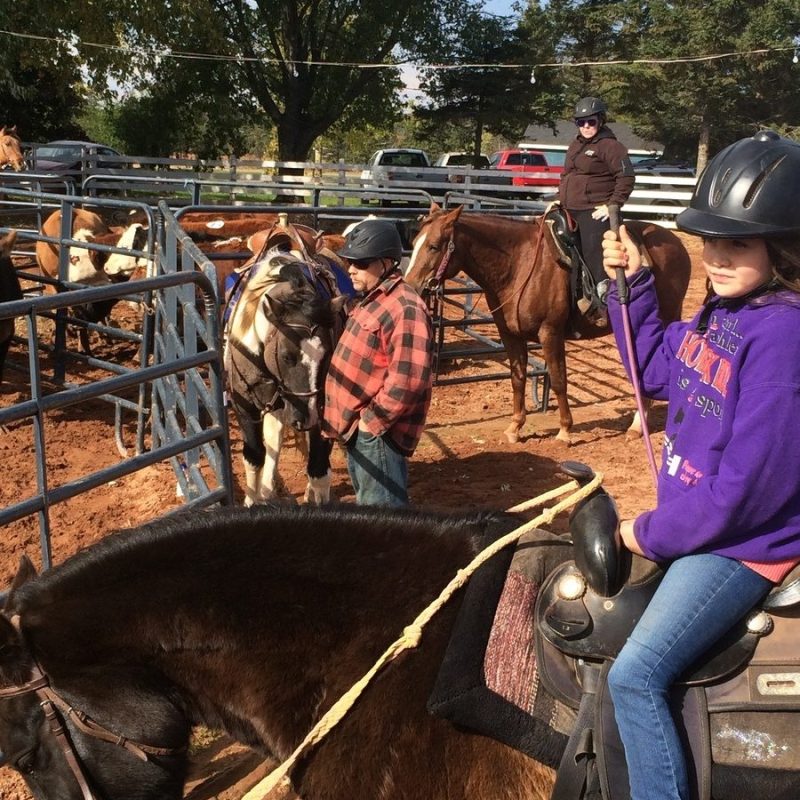 a group of people riding on the back of a horse