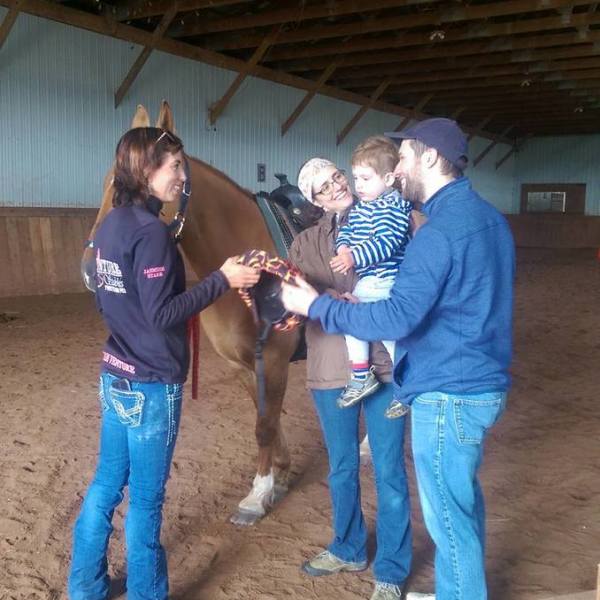 a man and a woman standing in front of a building