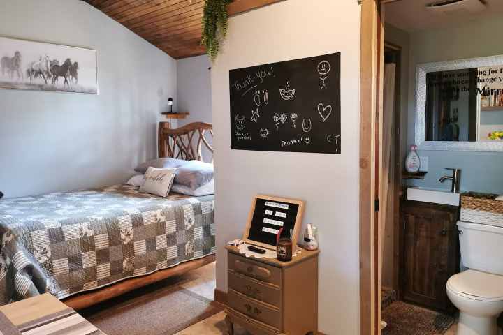 a bedroom with a bed in a room