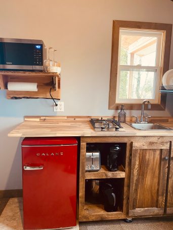 a microwave oven sitting on top of a wooden desk