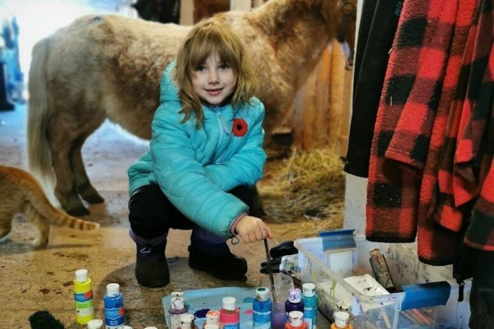 a group of people sitting around a dog