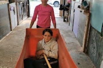 a person holding a bag of luggage