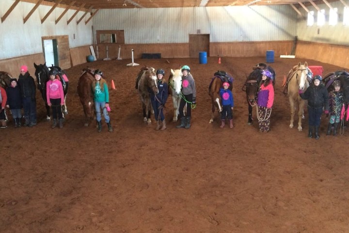 a group of people that are standing in the dirt